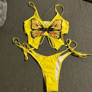 Yellow bikini size small with butterfly on top